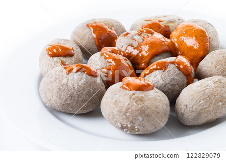 Papas arrugadas with mojo isolated on white background. Traditional Canary Islands food. 122829079