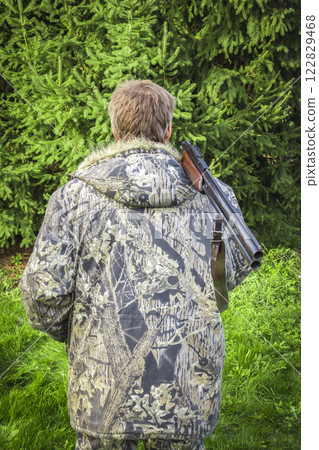 A hunter with a gun A hunter with a gun 122829468