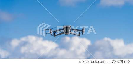 Drone flying blue sky 122829500