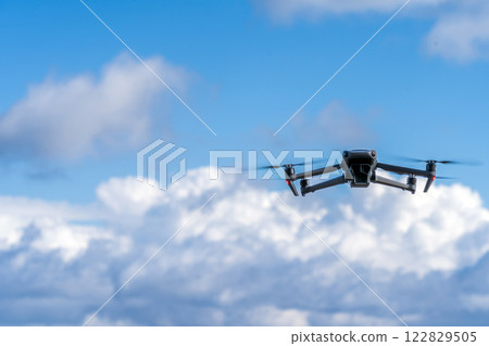 Drone flying blue sky 122829505
