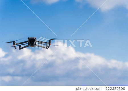 Drone flying blue sky 122829508