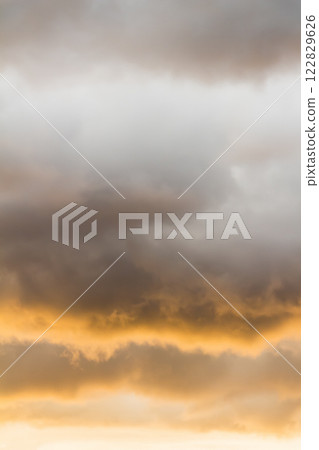 Thick clouds at sunset Thick clouds at sunset 122829626