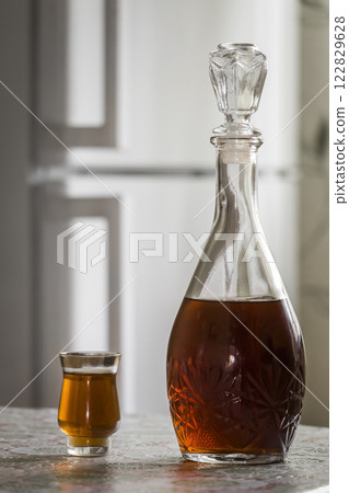 The decanter of brandy and a glass 122829628