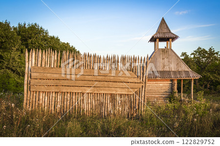 A wooden signboard on the fence. A wooden signboard on the fence. 122829752