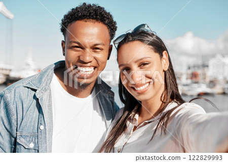 Couple, selfie and love bond on summer date in California by harbor, ocean and sea. Portrait, smile and happy latino man and woman or boyfriend and girlfriend after meeting on social media dating app Couple, selfie and love bond on summer date in California by harbor, ocean and sea. Portrait, smile and happy latino man and woman or boyfriend and girlfriend after meeting on social media dating app 122829993