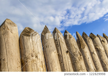 A fence made of stakes A fence made of stakes 122829998