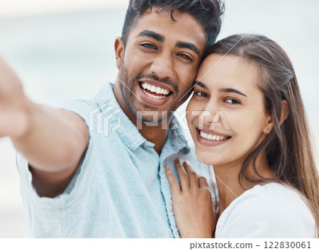 Love, happy and smile for selfie couple enjoy quality time on romantic outdoor date or holiday vacation. Romance, photo memory or relationship portrait of Indian man and girl relax, freedom and peace 122830061