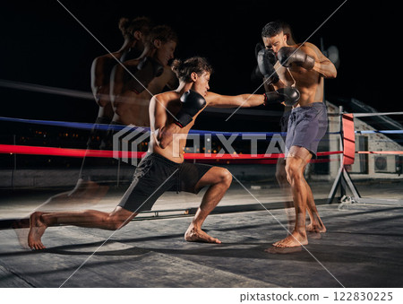 Sport, boxing and fight with a boxer and coach training for health, fitness and exercise in a ring at the gym. Workout, sports and cardio with a coach and student fighting for health and cardio 122830225