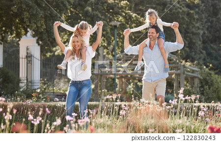 Mother, father and kids in a garden as a happy family outdoors in summer to relax, bond and have fun together. Flowers, children and young girls with mother and father playing in nature in spring 122830243