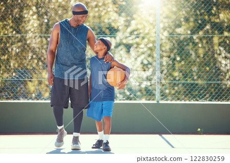 Father and son talking after basketball practice, training or fitness workout on a sport court together. African man and boy hug, love and smile while playing and learning sports game outdoor 122830259