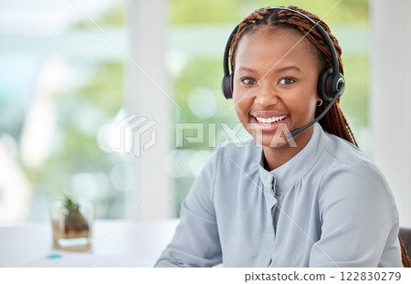 Portrait of a black customer support consultant, receptionist or call center agent with a headset. Happy, expert and professional woman employee working in ecommerce at a telemarketing company. Portrait of a black customer support consultant, receptionist or call center agent with a headset. Happy, expert and professional woman employee working in ecommerce at a telemarketing company. 122830279