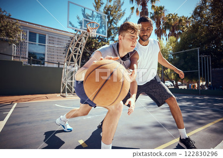 Basketball, sport and fitness with friends on a sports court outside with an opponent for a game or match. Exercise, training and workout with with a male athlete and his competition for health 122830296