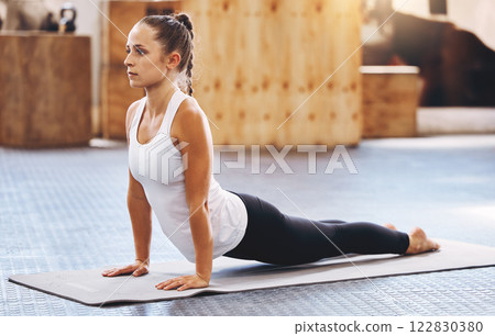 Pilates wellness exercise, woman on floor mat and practice alone yoga workout day. Fitness training motivation in sun light, health instructor stretching outdoors and athlete balance lifestyle 122830380
