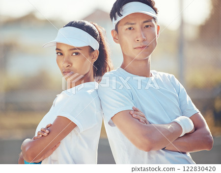 Tennis team, competitive sport and serious man and woman ready for a game or match on an outdoor court. Fitness with players standing together for collaboration during competition or tournament Tennis team, competitive sport and serious man and woman ready for a game or match on an outdoor court. Fitness with players standing together for collaboration during competition or tournament 122830420