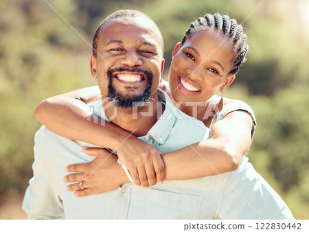 Face portrait of African couple in nature, hug on love date in park in summer and smile for care in garden in spring. Happy and relax man and woman in sun on walk in green countryside holiday 122830442