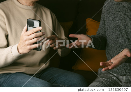 man asks to his partner for an explanation 122830497