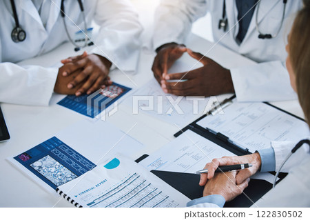 Paperwork, meeting and team of doctors consulting about medical treatment, medicine and surgery. Group of healthcare staff discussing patient results and documents in the hospital conference room. Paperwork, meeting and team of doctors consulting about medical treatment, medicine and surgery. Group of healthcare staff discussing patient results and documents in the hospital conference room. 122830502