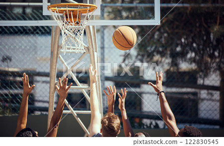 Basketball, sports and fitness with friends on a court for sport, health and exercise outside during summer. Training, workout and recreation with a team of players playing a game or match outdoors 122830545