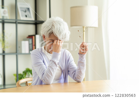 Tired senior woman Tired senior woman 122830563