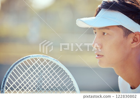 Tennis, sports and exercise focus of a Asian man athlete in a sport, training or fitness game. Player from Japan with a competitive mindset feeling healthy, strong and ready to start a workout match 122830802