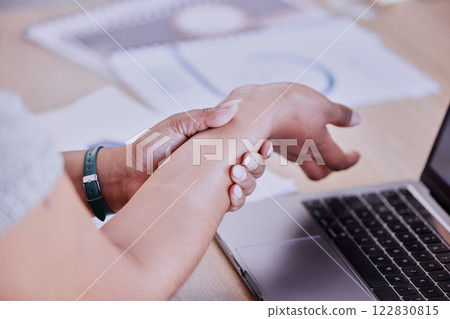 Business woman with carpal tunnel wrist pain, arthritis or muscle spasm from working on laptop in office. Worker with medical injury from typing fast on keyboard and working online in administration Business woman with carpal tunnel wrist pain, arthritis or muscle spasm from working on laptop in office. Worker with medical injury from typing fast on keyboard and working online in administration 122830815