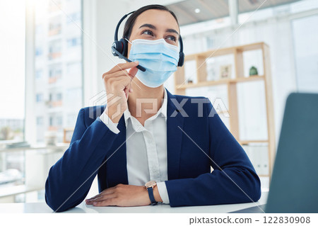Covid, telemarketing and customer service consultant with mask at desk while in communication with customer. Corporate help desk woman and worker helping client with crm problem and solution. Covid, telemarketing and customer service consultant with mask at desk while in communication with customer. Corporate help desk woman and worker helping client with crm problem and solution. 122830908