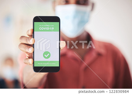 Covid, QR code and phone in person hand for vaccinated digital verification certificate or passport at an airport, hospital or clinic. Man with smartphone and screen technology for coronavirus safety Covid, QR code and phone in person hand for vaccinated digital verification certificate or passport at an airport, hospital or clinic. Man with smartphone and screen technology for coronavirus safety 122830984