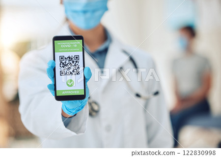 Covid vaccine barcode on phone, digital passport on screen of smartphone for security and future travel and online certificate for insurance. Hand of doctor with document on web for safety and health Covid vaccine barcode on phone, digital passport on screen of smartphone for security and future travel and online certificate for insurance. Hand of doctor with document on web for safety and health 122830998