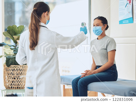 Healthcare, compliance and covid scan by doctor and patient with digital thermometer in a consultation room. Healthcare worker checking for fever and corona symptoms, practice safety during pandemic Healthcare, compliance and covid scan by doctor and patient with digital thermometer in a consultation room. Healthcare worker checking for fever and corona symptoms, practice safety during pandemic 122831006