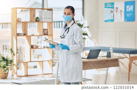 Insurance checklist and covid healthcare doctor with face mask and portrait while working with medical paperwork in an office. Trust and vision of a covid 19 expert woman checking vaccination results Insurance checklist and covid healthcare doctor with face mask and portrait while working with medical paperwork in an office. Trust and vision of a covid 19 expert woman checking vaccination results 122831014