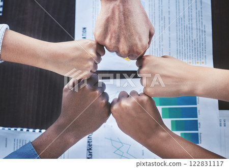 Hands of business people for support, motivation for team goal and trust in partnership with finance employees in a meeting, seminar or workshop. Fist bump for teamwork, collaboration and solidarity 122831117