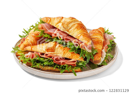 croissant sandwiches with ham and lettuce on plate croissant sandwiches with ham and lettuce on plate 122831129