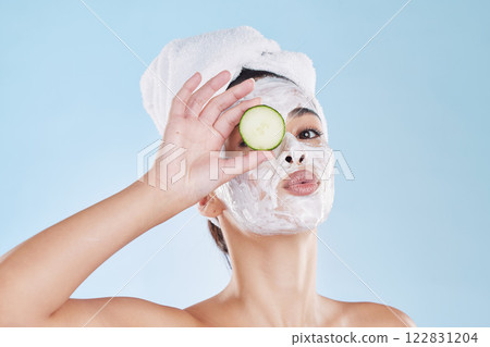 Skincare, cucumber and beauty face mask portrait of a beautiful woman taking natural care of her clean and healthy skin. Fresh, wellness and relax during routine pamper spa cosmetology treatment 122831204