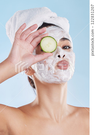 Beauty, skincare and face mask with cucumber slice portrait of beautiful woman taking care of her clean and healthy skin. Fresh, wellness and relax during routine pamper spa cosmetology treatment Beauty, skincare and face mask with cucumber slice portrait of beautiful woman taking care of her clean and healthy skin. Fresh, wellness and relax during routine pamper spa cosmetology treatment 122831207