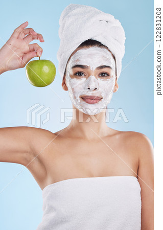 Woman, skincare and apple face mask, organic beauty and wellness for healthy face, fresh facial and natural clean glowing skin on studio blue background. Portrait, shower and model grooming bodycare Woman, skincare and apple face mask, organic beauty and wellness for healthy face, fresh facial and natural clean glowing skin on studio blue background. Portrait, shower and model grooming bodycare 122831208