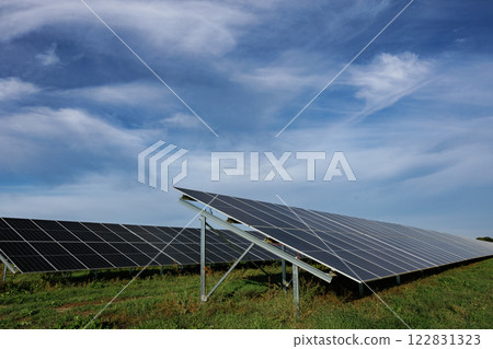 Solar panels providing clean energy under a cloudy sky 122831323