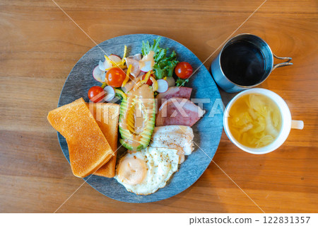 A nutritious morning plate of avocado, toast and salad chicken A nutritious morning plate of avocado, toast and salad chicken 122831357