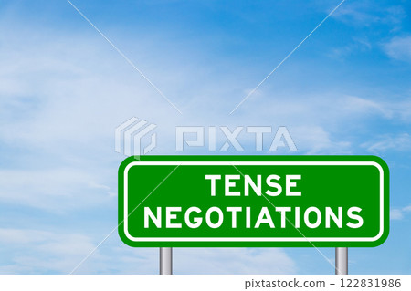 Green color transportation sign with word tense negotiations on blue sky with white cloud background 122831986