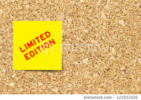 Yellow note paper with word limited edition on cork board background with copy space Yellow note paper with word limited edition on cork board background with copy space 122832026