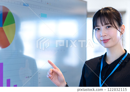 A young businesswoman giving a presentation using a monitor A young businesswoman giving a presentation using a monitor 122832115