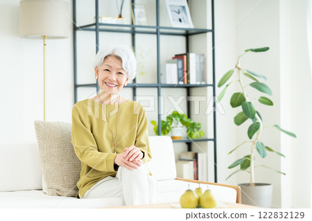 Senior woman relaxing in the living room Senior woman relaxing in the living room 122832129