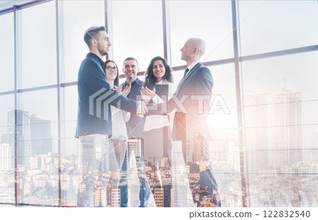 Two confident business man shaking hands during a meeting in the office, success, dealing, greeting and partner concept Two confident business man shaking hands during a meeting in the office, success, dealing, greeting and partner concept 122832540