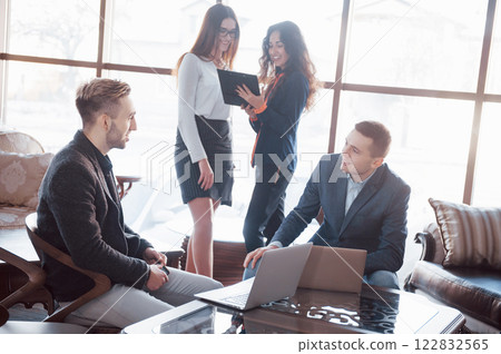 Two confident business man shaking hands during a meeting in the office, success, dealing, greeting and partner concept. Two confident business man shaking hands during a meeting in the office, success, dealing, greeting and partner concept. 122832565