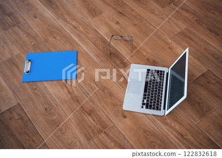 laptop glasses tablet on the floor parquet wood background wide laptop glasses tablet on the floor parquet wood background wide 122832618