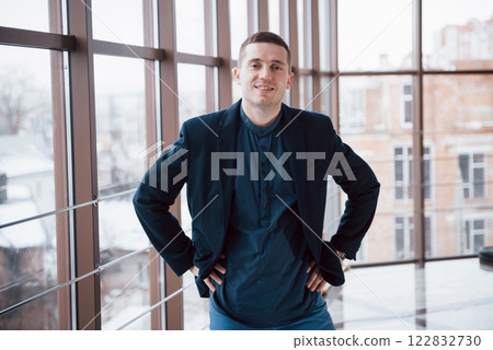 happy young business man work in modern office on computer happy young business man work in modern office on computer 122832730