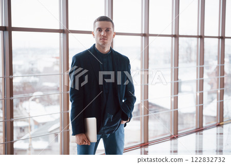happy young business man work in modern office on computer 122832732