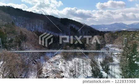 Aerial view of Yamabiko Suspension Bridge in winter 122833308