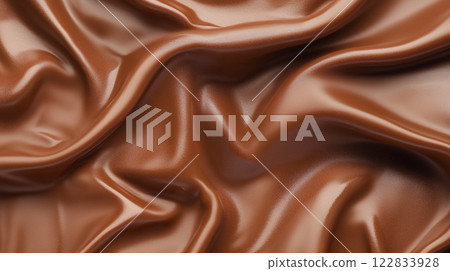 Piece of brown fabric with a pattern on it. The fabric is folded and has a shiny appearance Piece of brown fabric with a pattern on it. The fabric is folded and has a shiny appearance 122833928