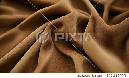 Piece of brown fabric with a pattern on it. The fabric is folded and has a wrinkled appearance 122833933