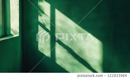 Window casts a shadow on a wall. The shadow is large and dark, and it covers a significant portion of the wall. The room is dimly lit, and the shadow adds a sense of depth and dimension to the space 122833984